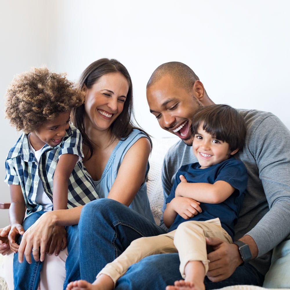 A family laughs and connects with one another.