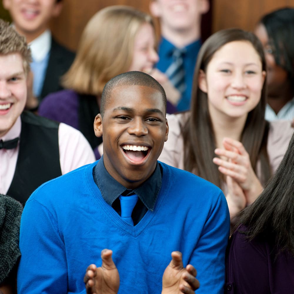 Group of people sing together during a church service.